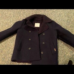 Fleece-like double breasted pea coat for boys size 7. Color is dark navy/black.